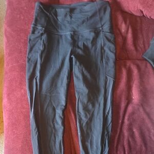 Athleta Black High-Waisted Leggings With Peek-a-Boo Mesh Side Panels